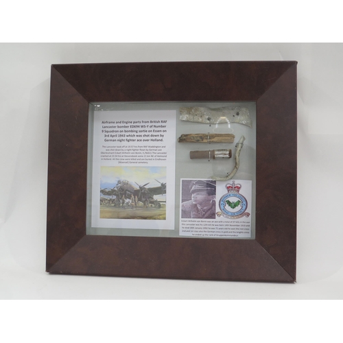 9167 - A framed display of RAF Lancaster bomber aircraft crash items with research relating to Lancaster ED... 