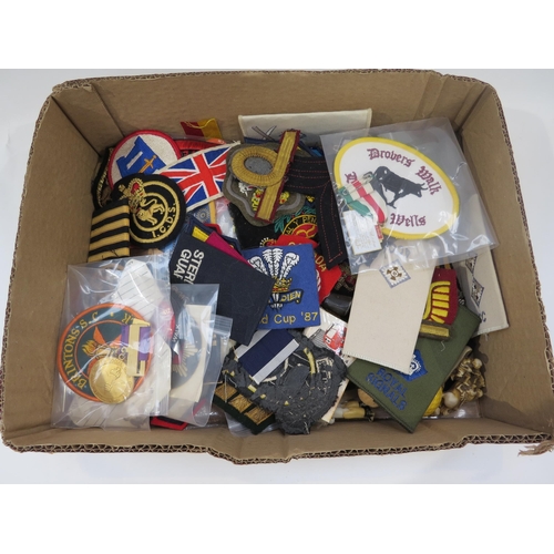 9169 - A box of mixed cloth badges, various rally badges and a bag of Hornchurch St. George's Day badges