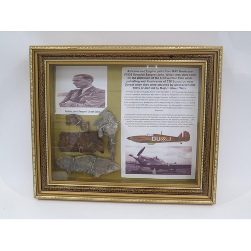 9170 - A framed display of RAF Polish Spitfire pilot's crash items with research