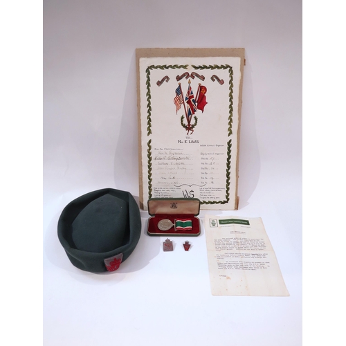 9220 - A Women's W.R.V.S. hat with cased medal, WWII Defence Medal, badges with 1939-45 scroll to MRS E. LA... 