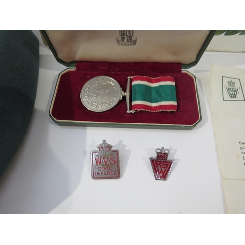 9220 - A Women's W.R.V.S. hat with cased medal, WWII Defence Medal, badges with 1939-45 scroll to MRS E. LA... 