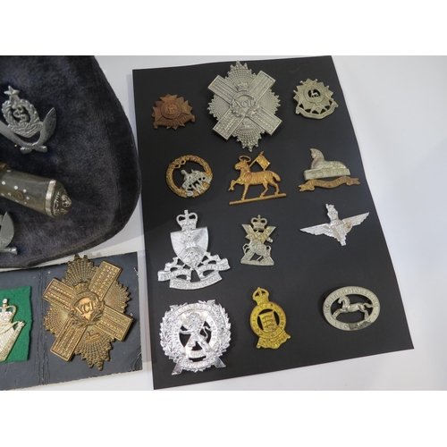 9236 - A quantity of mixed cap badges including highland regiments, together with a Gurkha shield display e... 