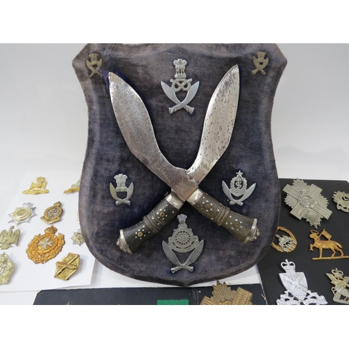 9236 - A quantity of mixed cap badges including highland regiments, together with a Gurkha shield display e... 