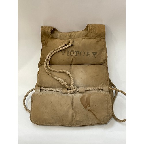 9007 - A marine buoyancy aid / life jacket with rope mounts, stencilled 'FRONT' to front and 'VICTORY' to r... 