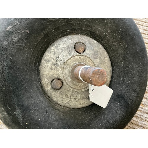 9014 - A WWII British fighter aircraft wheel on axle, relic condition, thought to be from a crashed Spitfir... 