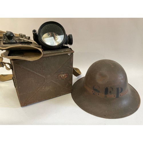 9015 - A WWII signalling lamp, cased, together with a WWII SFP helmet (2)