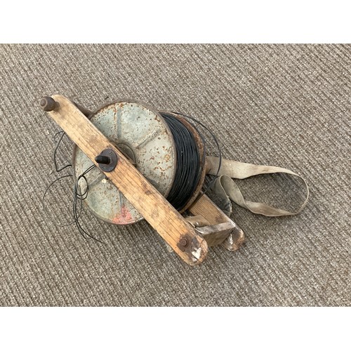 9024 - A circa 1952 British Army cable reel with webbing and tool