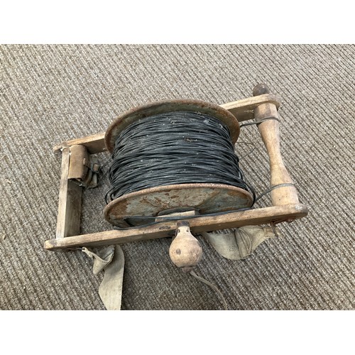 9024 - A circa 1952 British Army cable reel with webbing and tool