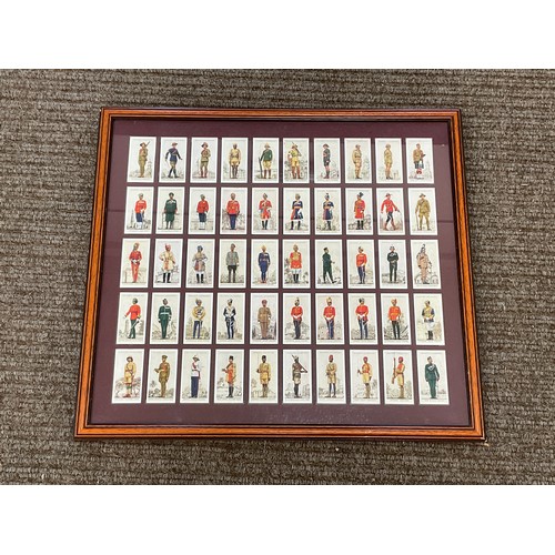 9037 - A framed display of 50 Player's 'Military Uniforms of the British Empire Overseas' cigarette cards, ... 