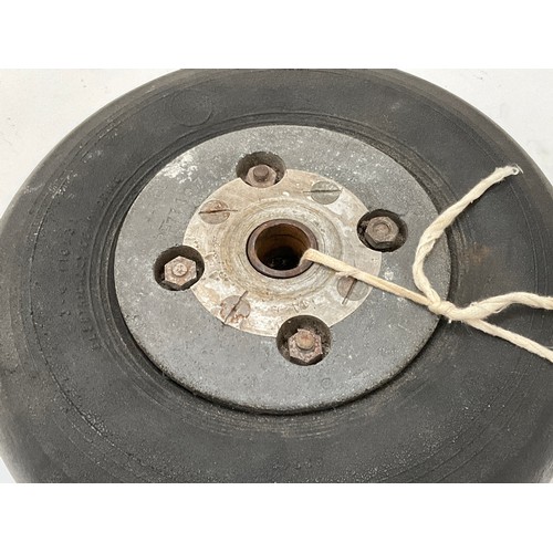 9047 - A WWII Spitfire rear wheel, serial number RF77197/1