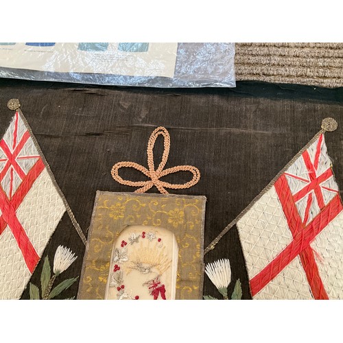 9048 - A WWI embroidered silk panel with crossed Naval ensign flags and central sweetheart postcard (a/f), ... 