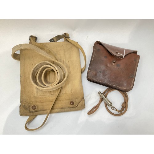 9049 - A WWII webbing map case together with a WWI dated trench whistle and a WWI folding trench saw in lea... 