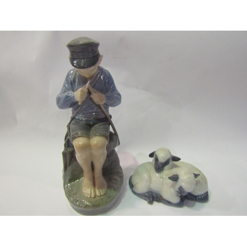 4287 - A Royal Copenhagen Boy Whittling, 18cm tall, together with a Royal Copenhagen figural group of sleep... 