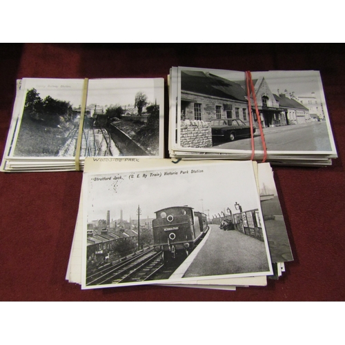 4335 - A selection of vintage black and white railway station photos, an album of transport postcards and t... 