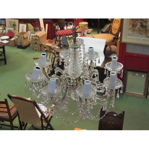 4469 - An eight arm chandelier 55cm diameter, 50cm drop