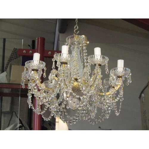 4471 - An eight arm chandelier 55cm, 50cm drop. Also three wall lights plus some spares