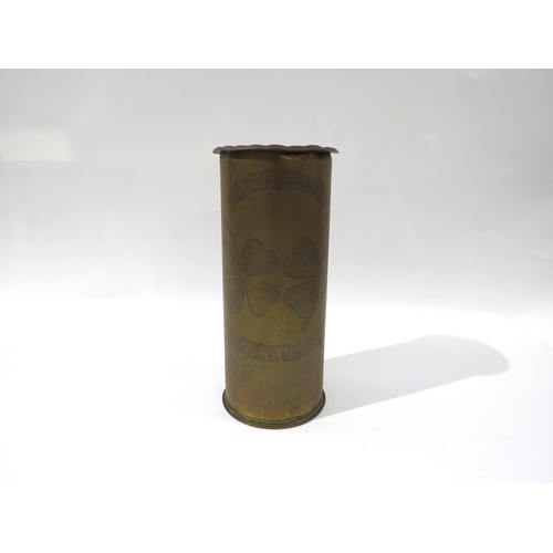 9185 - A WWI brass trench art shell case, engraved with 'SOUVENIR LA GUERRE' lettering and four-leaf clover... 