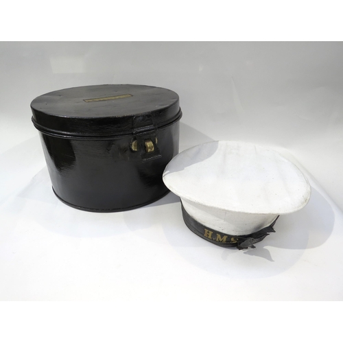 9190 - A Royal Navy black hat box and white hat