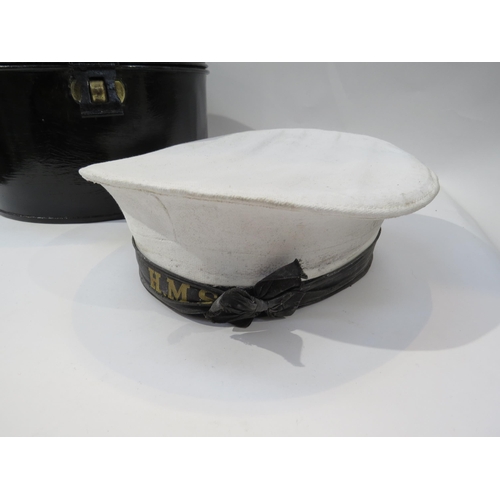 9190 - A Royal Navy black hat box and white hat