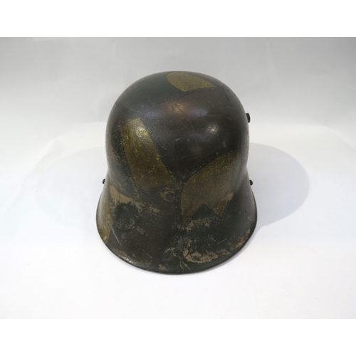 9194 - A reproduction WWI German 1916 Pattern camouflage helmet with replacement liner