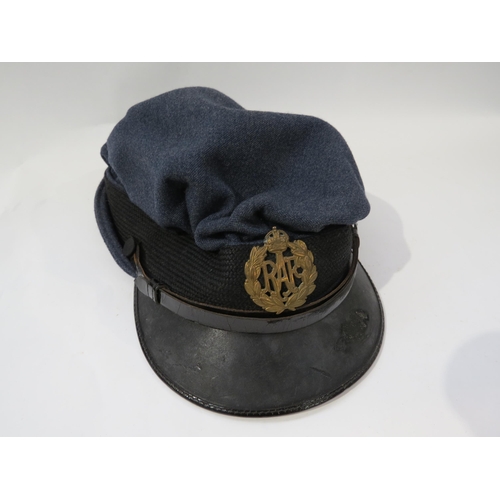 9200 - A WWII RAF Royal Air Force forage / side cap, single plastic badge, dated 1943, size 6 1/2, together... 