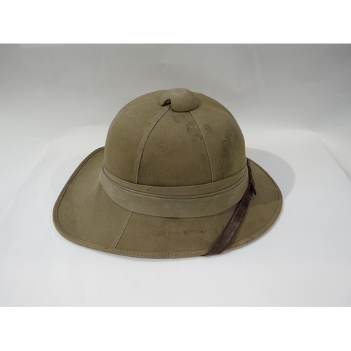 9204 - NORFOLK REGIMENT INTEREST: A WWII pith helmet dated 1942, with Norfolk 1st Bn. flash to side and lea... 