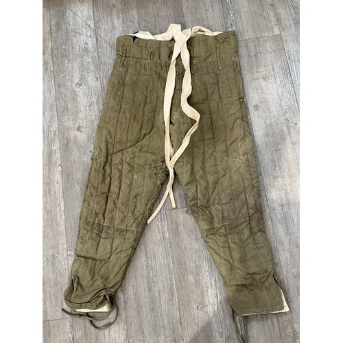 9087 - A pair of WWII British padded cold weather trousers, size 4, dated 1944, by Morris, slight ink stain... 