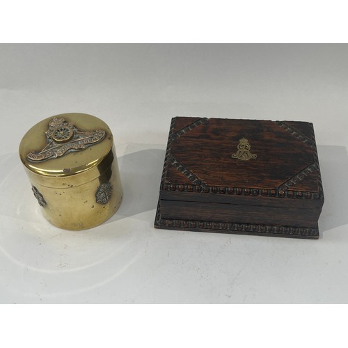 9381 - NORFOLK INTEREST: A trench art brass trinket box with applied Royal Artillery badge, together with a... 