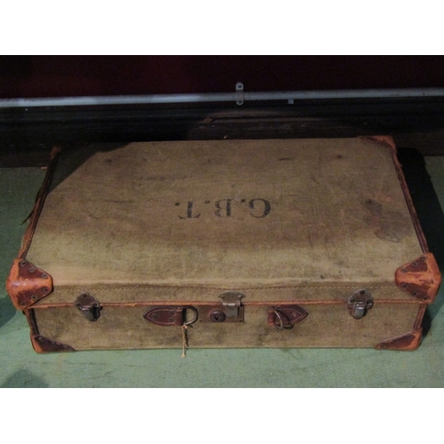 2463 - A vintage canvas suitcase containing Christmas decorations and a 