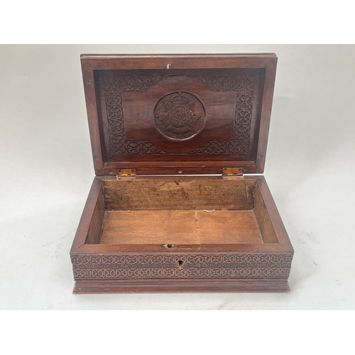 9387 - A carved hardwood trinket box with Royal Army Service Corps crest carved to inside of lid, 26cm wide