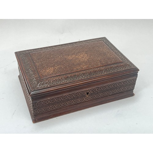 9387 - A carved hardwood trinket box with Royal Army Service Corps crest carved to inside of lid, 26cm wide