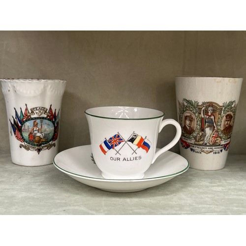 9388 - NORFOLK INTEREST: Two WWI Victory beakers, one with Shipdham Souvenir of the War text, together with... 