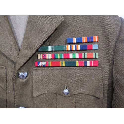 9094 - A South African colonel's uniform, the jacket with medal bar, together with two pairs of trousers an... 