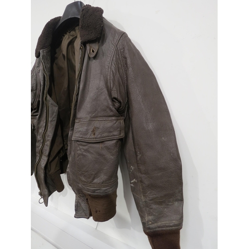 9097 - A WWII or later brown leather pilot's flying jacket