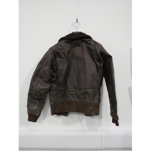 9097 - A WWII or later brown leather pilot's flying jacket