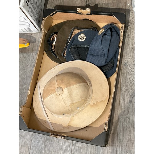 9110 - Two boxes of various British military headwear including pith helmet, RAF berets etc