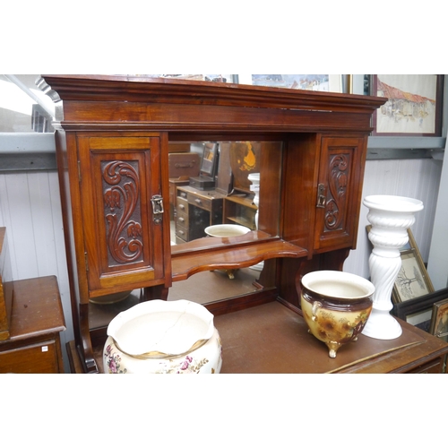 2485 - An Art Nouveau carved mahogany mirror back wall cupboard