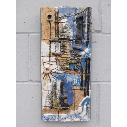 7223 - A Brutalist wall hanging tile panel by Cuby Ceramics of Cornwall. Label verso.  Overall size  50cm x... 