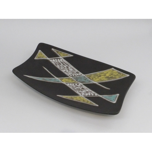 7023 - A Danish Soholm Pottery oblong pedestal dish, black ground with geometric shapes in colours. 41cm x ... 