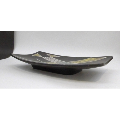 7023 - A Danish Soholm Pottery oblong pedestal dish, black ground with geometric shapes in colours. 41cm x ... 