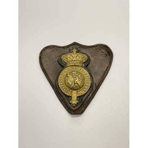 9518 - An Infantry Mounted Officers gilt metal and leather backed badge