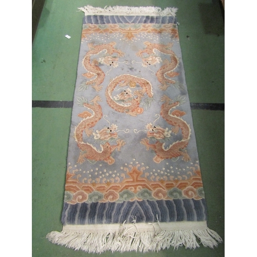 4196 - A circular Chinese rug, rectangular Chinese fireside rug and dyed sheepskin rug (3)