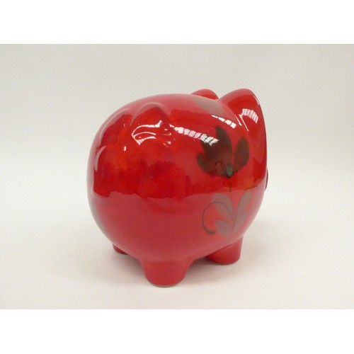 7018 - A Scheurich West German pottery large piggy bank with red glaze and floral design. 17.5cm high x 20c... 