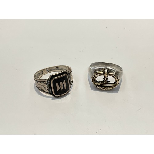 9527 - Two silver signet rings, one bearing German SS Panzer enamelled logo with foliate shoulders, the oth... 