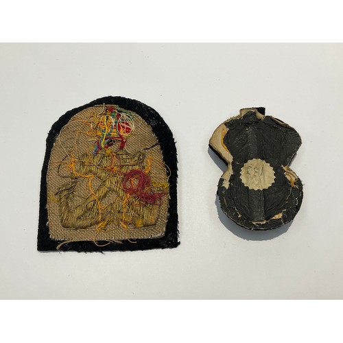 9526 - A Chief Petty officer's cap badge, possibly WWII era, together with sleeve badge to a Petty Officer,... 