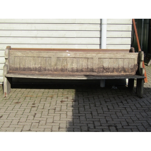 2001 - A Victorian weathered oak pew 270cm long