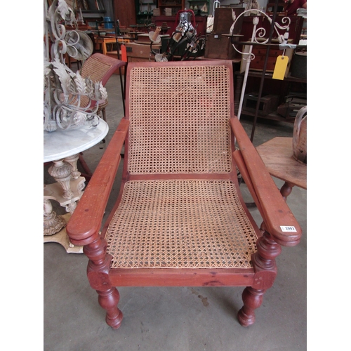 2003 - A pair of hardwood and cane plantation chairs