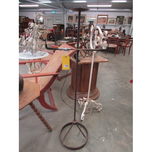 2009 - A pair of wrought iron three arm pricket candle stands