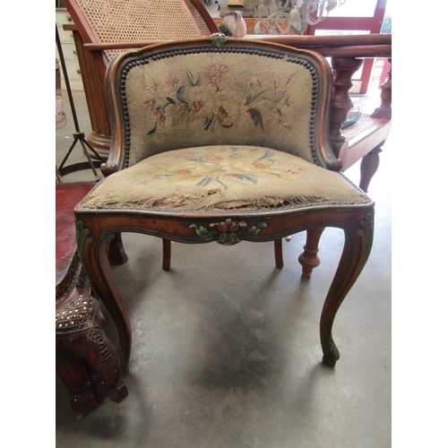 2016 - A French painted 19th Century walnut boudoir chair with worn needlepoint and brass stud decoration