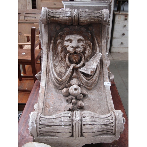 2038 - A 19th century plaster corbel of a lion's head 65 x 47cm